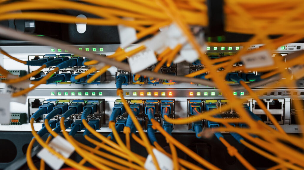 Close up view of internet equipment and cables in the server room.